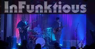 InFunktious performing under blue stage lighting